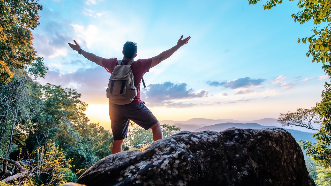 Person hiking and very happy.