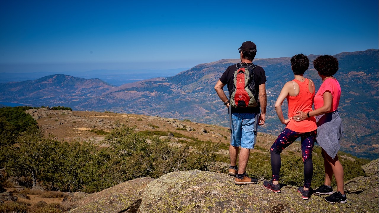 Tourists on a rock contemplating the scenery