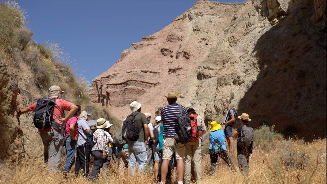 Group of hikers walking in the Geopark of Granada.