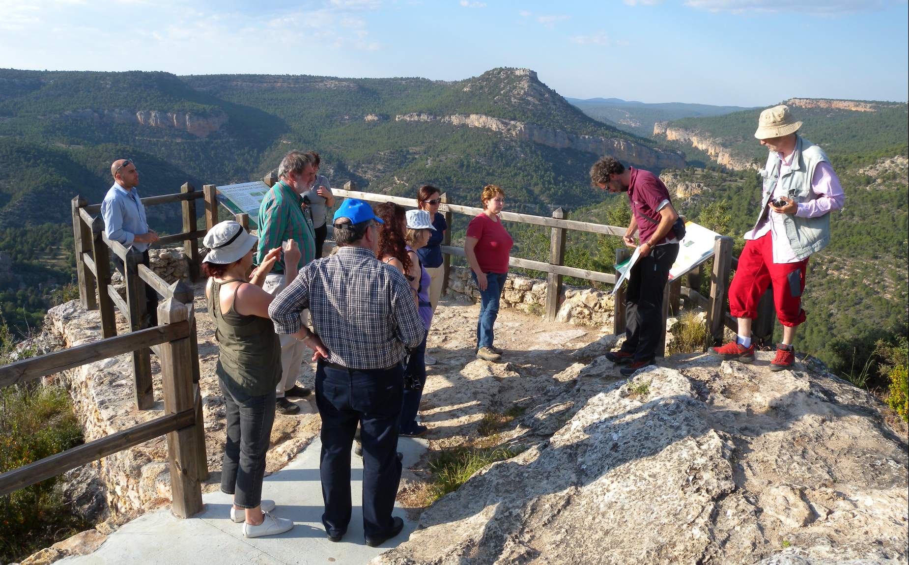 Several people with a guide on a mountain